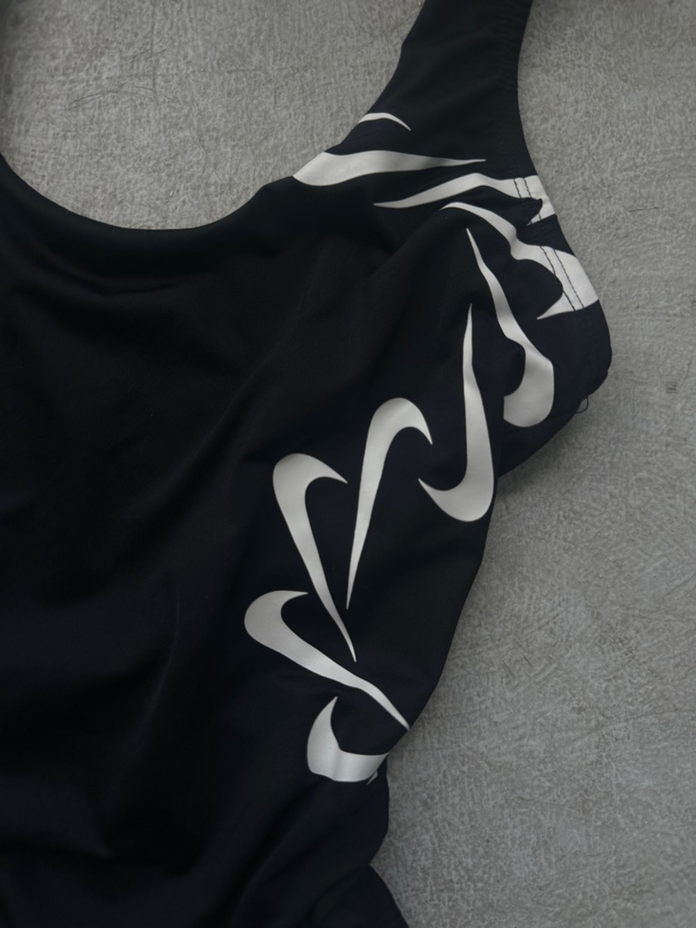Nike Black One-Piece Swimsuit with White Swoosh Wave Accents - Picture 2 of 3